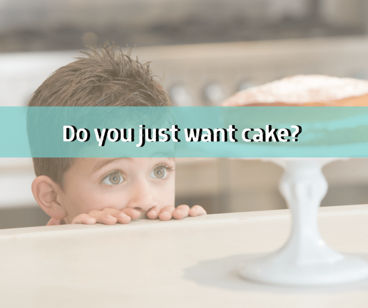 little boy staring at cake wanting a snack