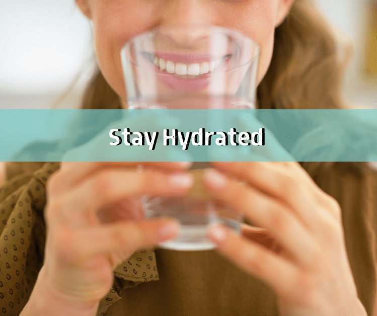woman drinking water to stay healthy