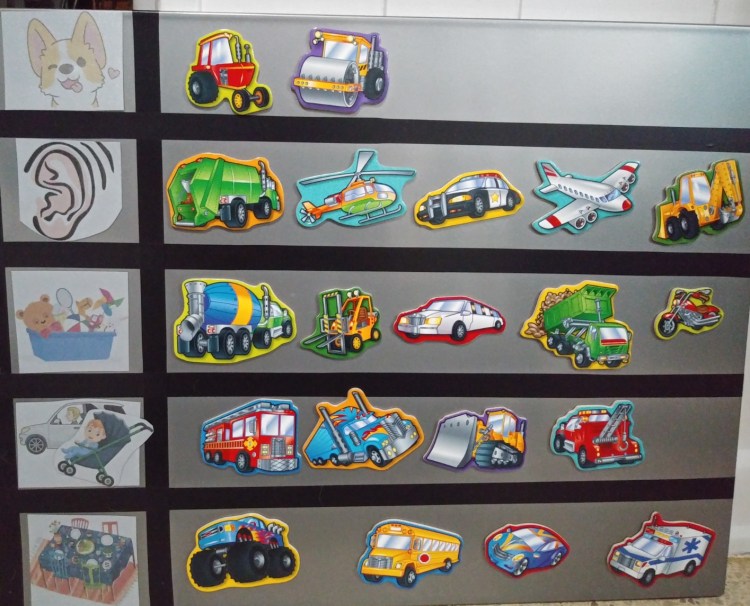 vehicle magnets on a reward board for kids