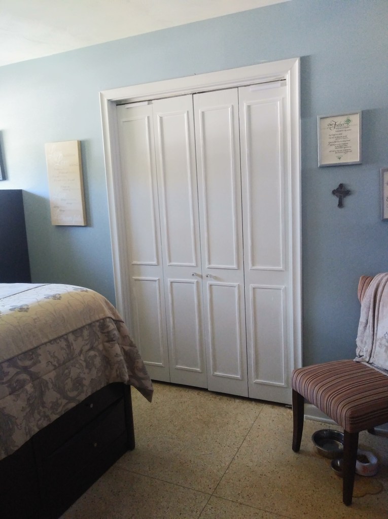 Redone louver doors that have been covered, trimmed out, and painted